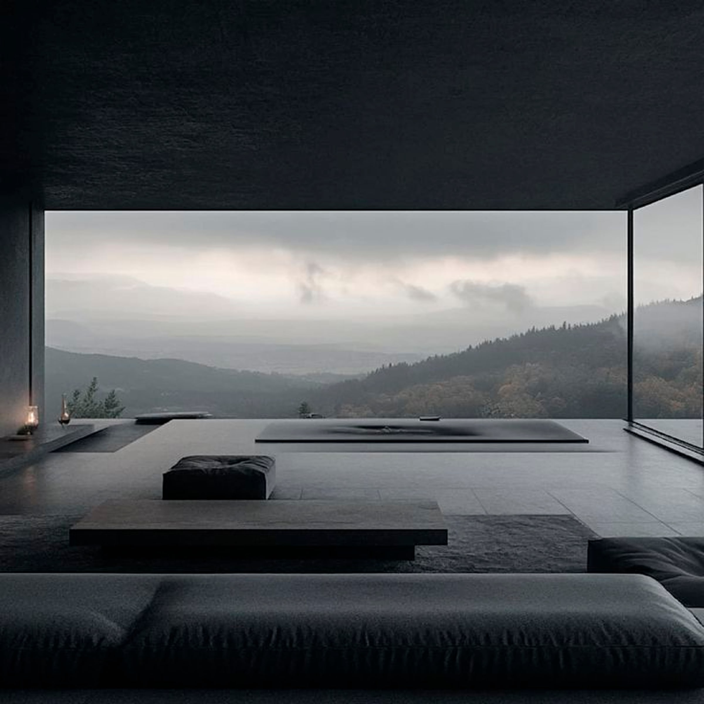 A dark interior looking out to misted hills
